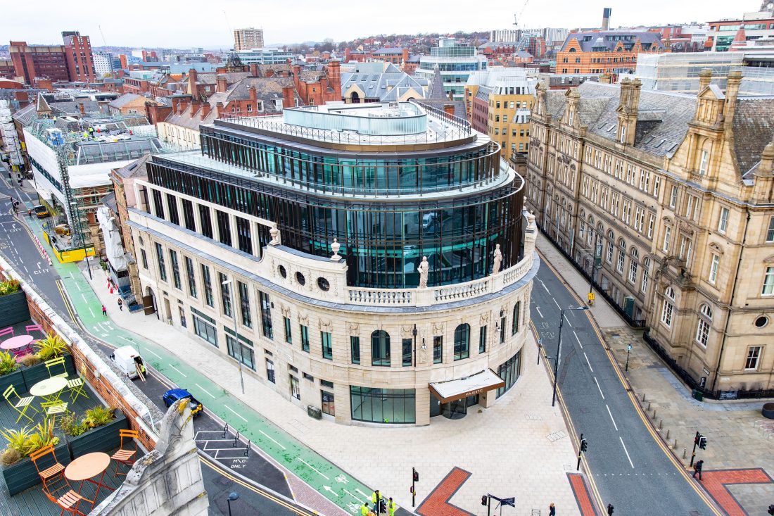 Photo of the Majestic in Leeds city centre – a heritage development by Rushbond with Classical architecture beneath modern, glass top floors.